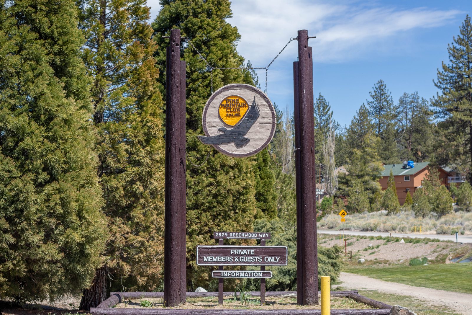 Pine Mountain Club sign among the pines