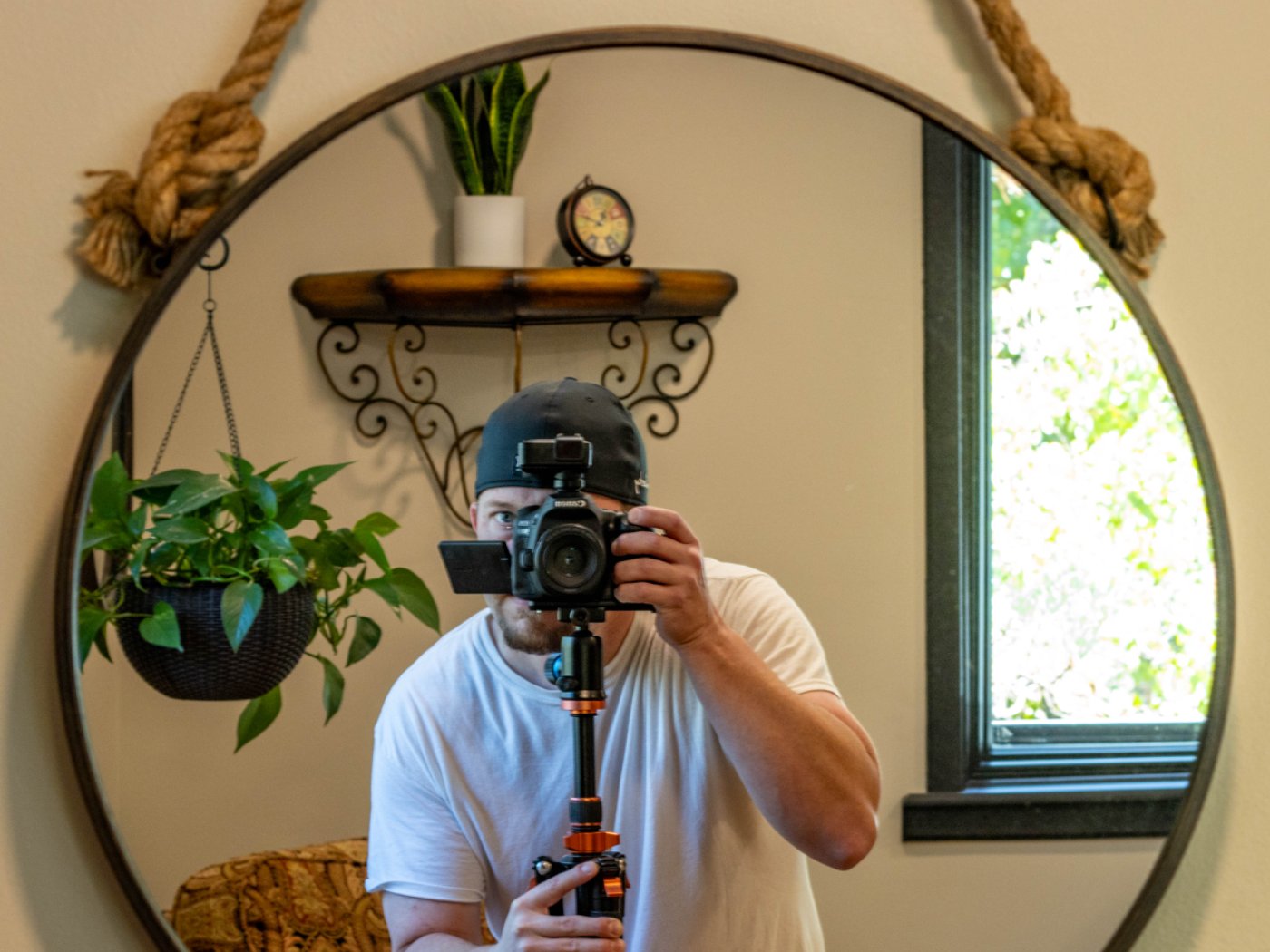 Jacob Mowry photographed in a mirror, camera on a tripod