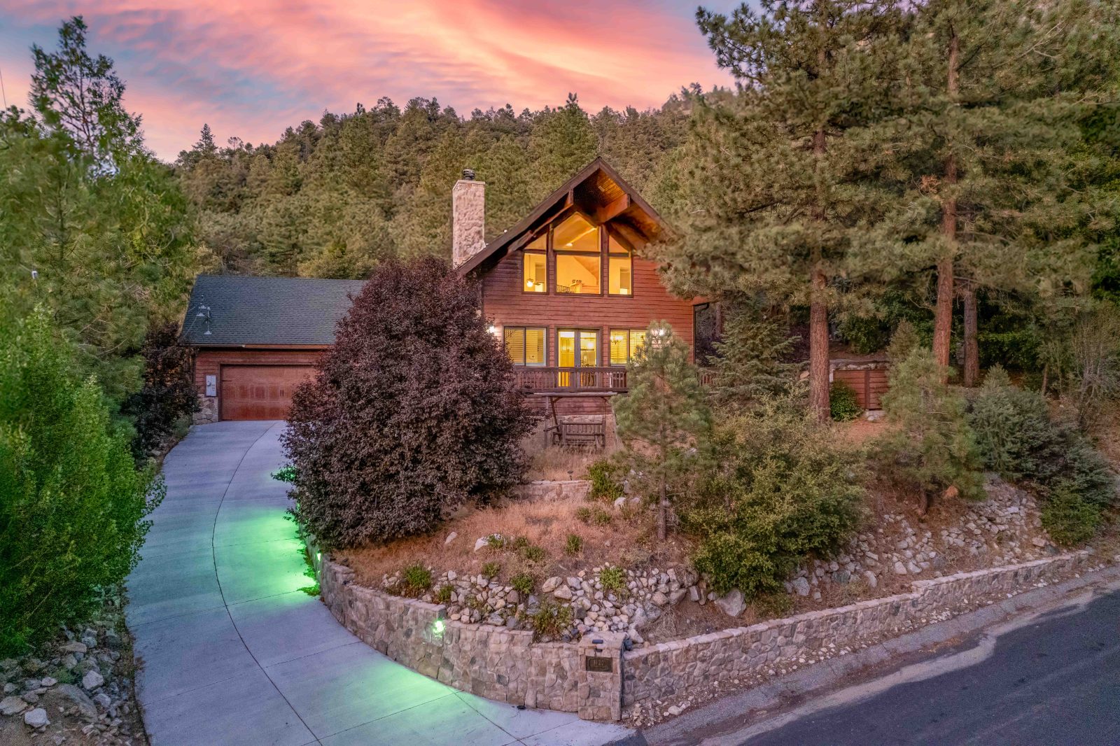 Log cabin at dusk among pines