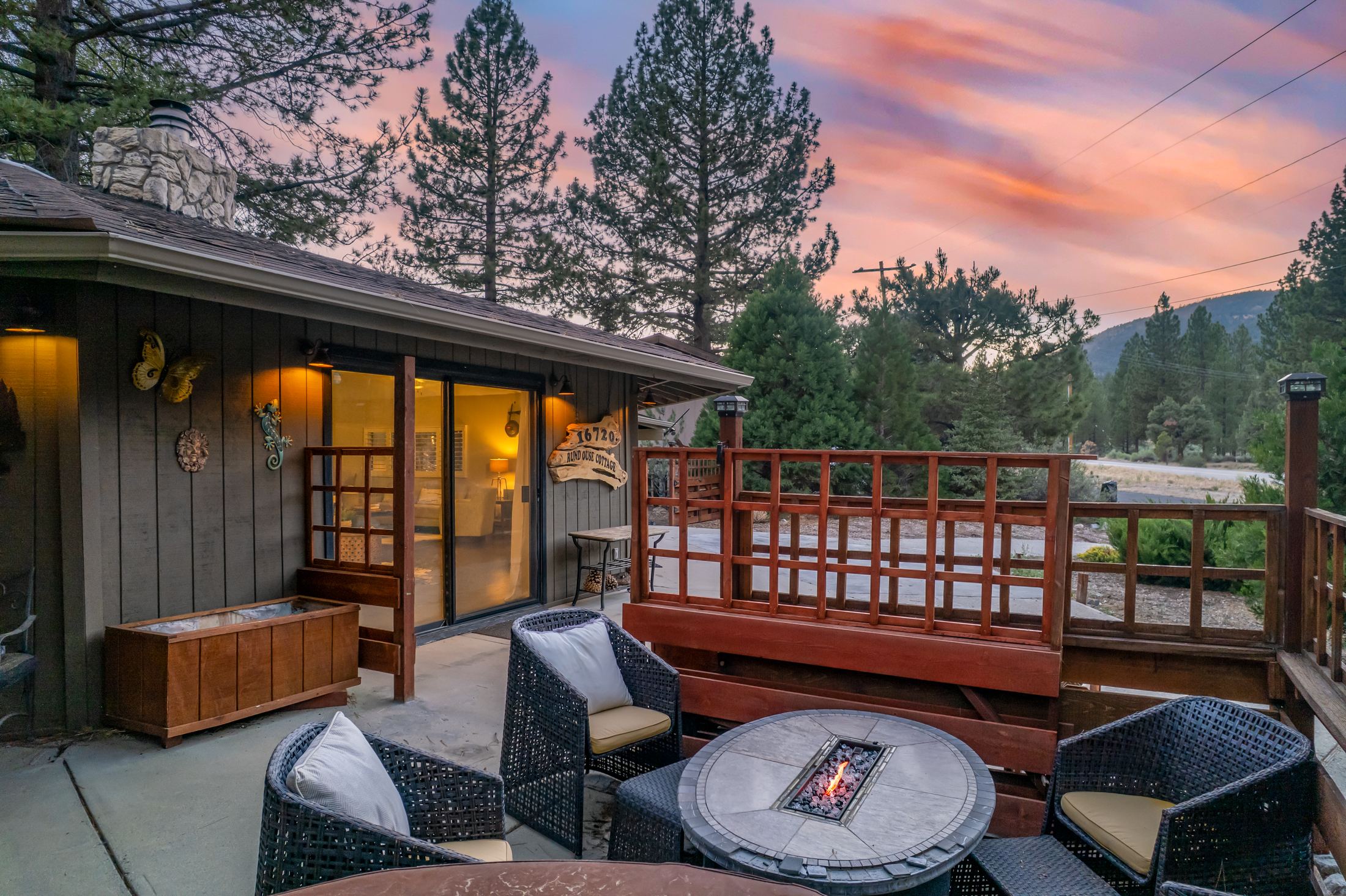 Twilight patio with a fire pit at a Pine Mountain Club cabin