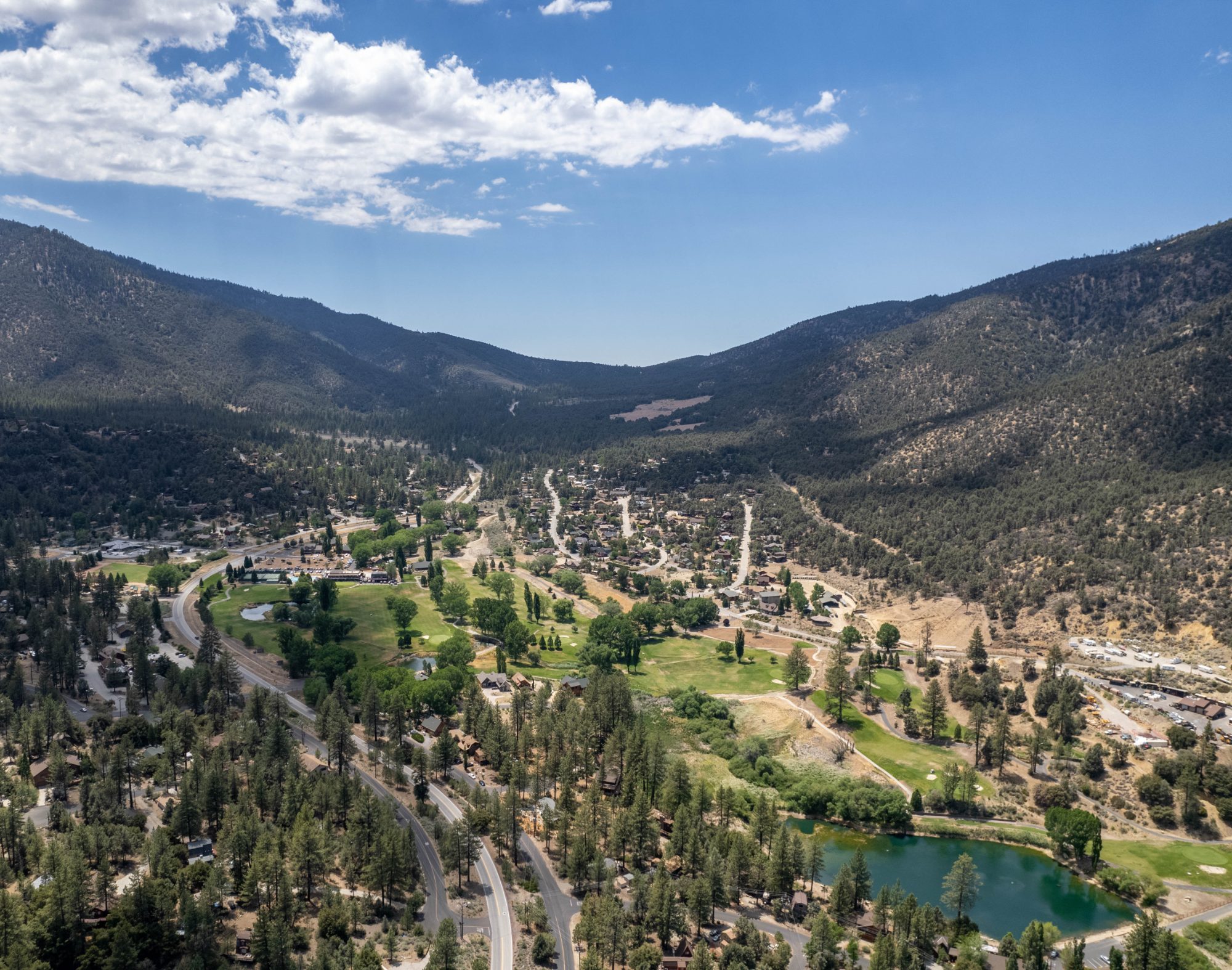 Summer aerial over the village, golf course and lake